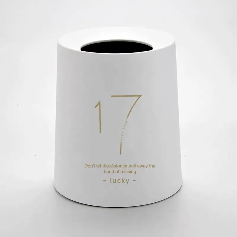 Creative Nordic plastic trash can with decorative pattern in a home setting