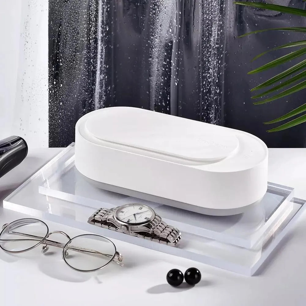 White portable ultrasonic cleaning machine with stainless steel tank and touch button.