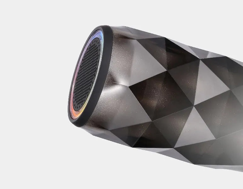 Black crystal diamond cut Coca-Cola can Bluetooth speaker lantern with colourful LED lights illuminated.