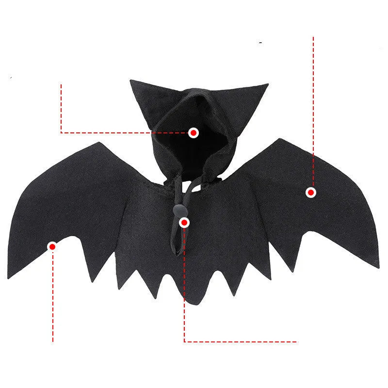 Black felt bat wing costume for cats and dogs with Velcro strap, size L shown on a pet