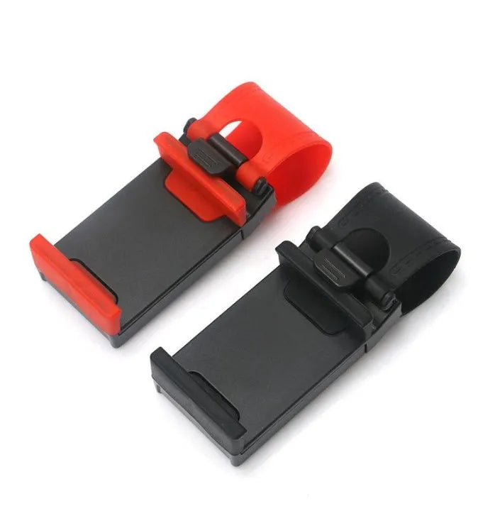 Black steering wheel phone holder clip mounted on car steering wheel holding smartphone
