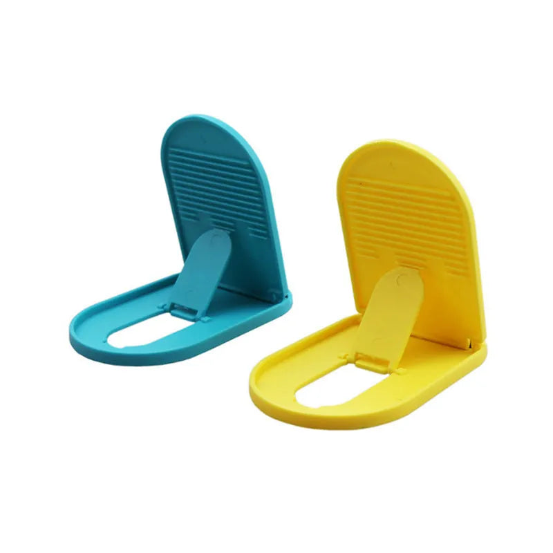 Plastic mobile phone stand in six colour options showing bracket design for desk use
