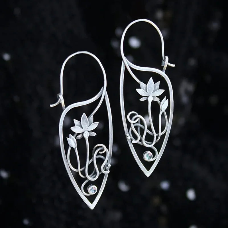 Silver lotus vine floral earrings with geometric elements and rhinestone accents