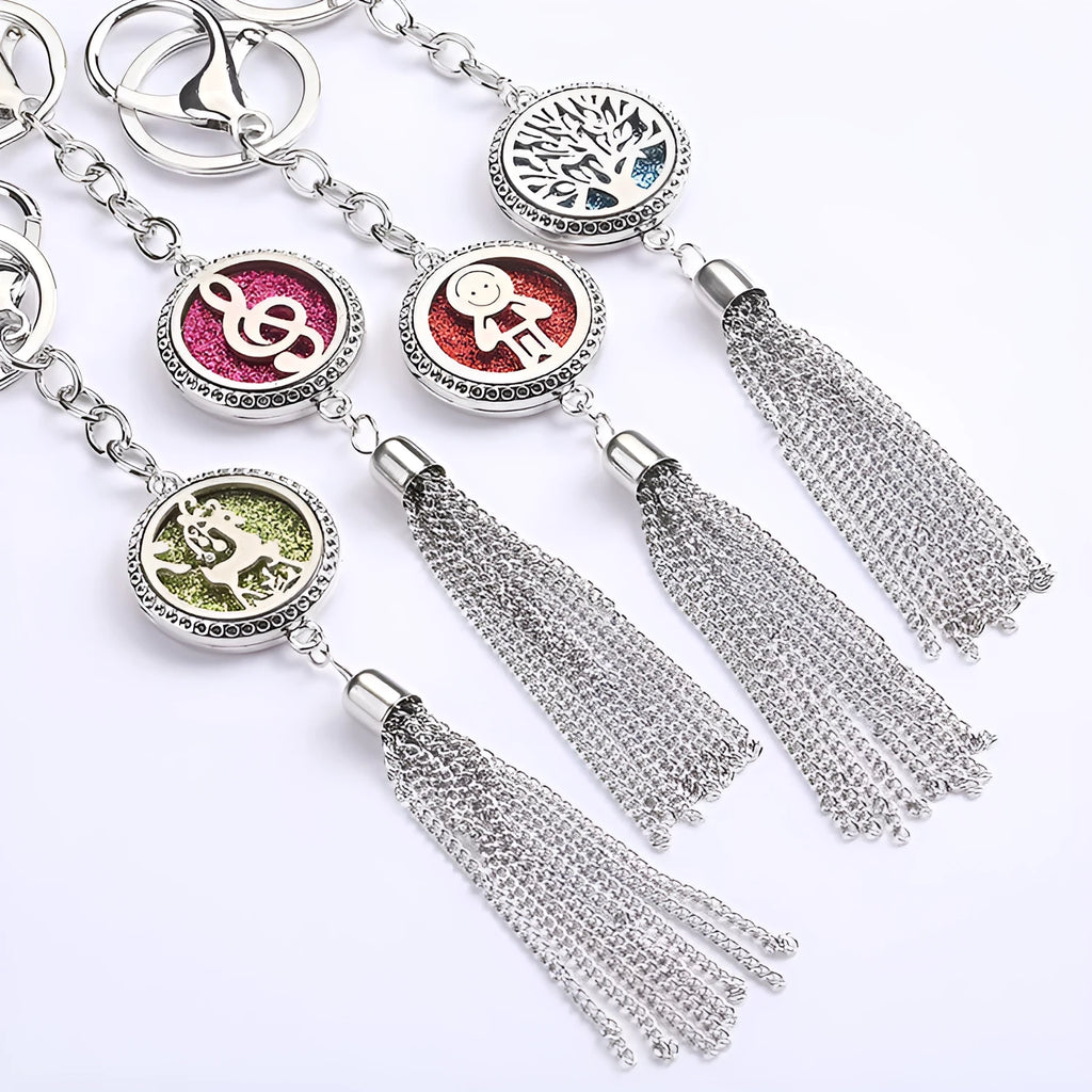 Silver alloy tassel car pendant on a chain with coloured scent cotton pads for essential oils.