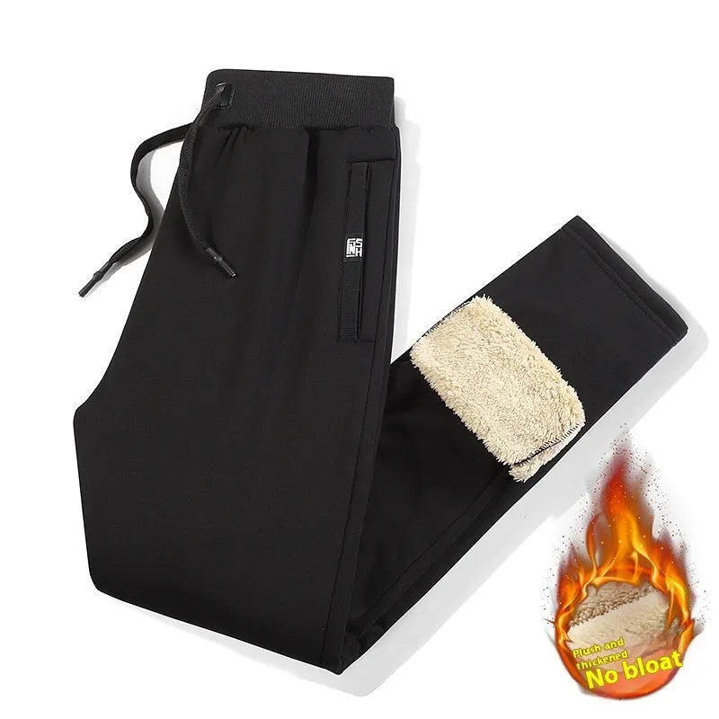 Men's grey fleece-lined oversized track pants with elastic waistband and straight leg design
