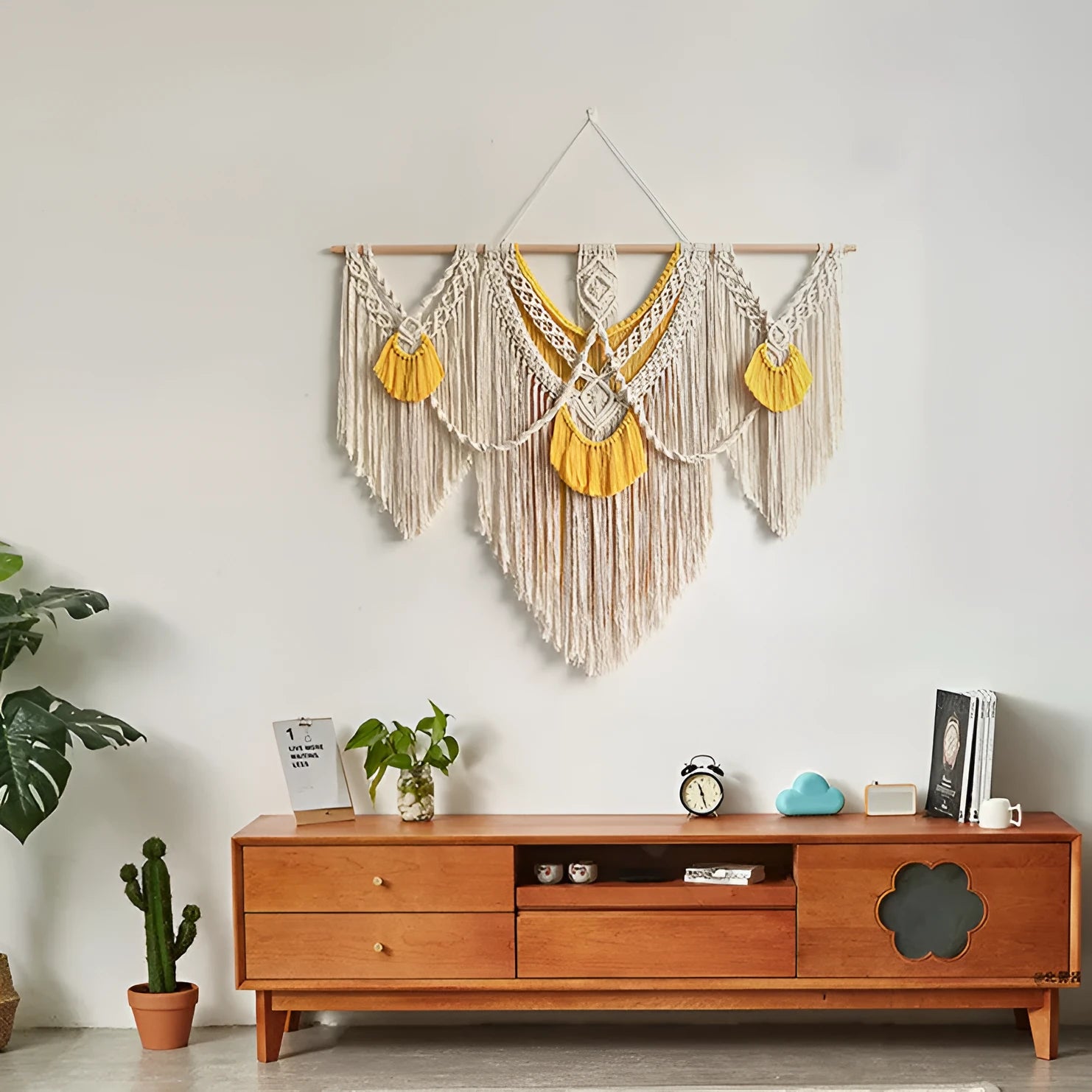 Hand-woven cotton Nordic tapestry wall hanging with creamy white and yellow colours