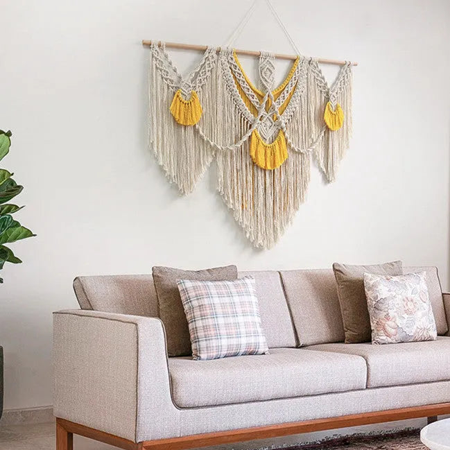 Hand-woven cotton Nordic tapestry wall hanging with creamy white and yellow colours