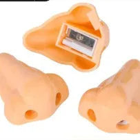 Flesh-coloured plastic geometry-shaped pencil sharpener with a large nostril.
