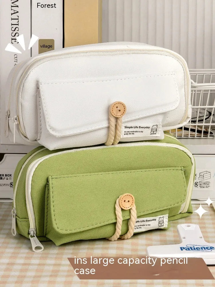 Korean-style canvas pencil case in green, beige, blue, and grey colours with large capacity for pens