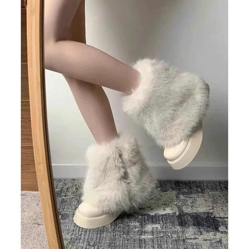 Women's artificial plush snow boots with fleece lining and waterproof platform sole in black or white