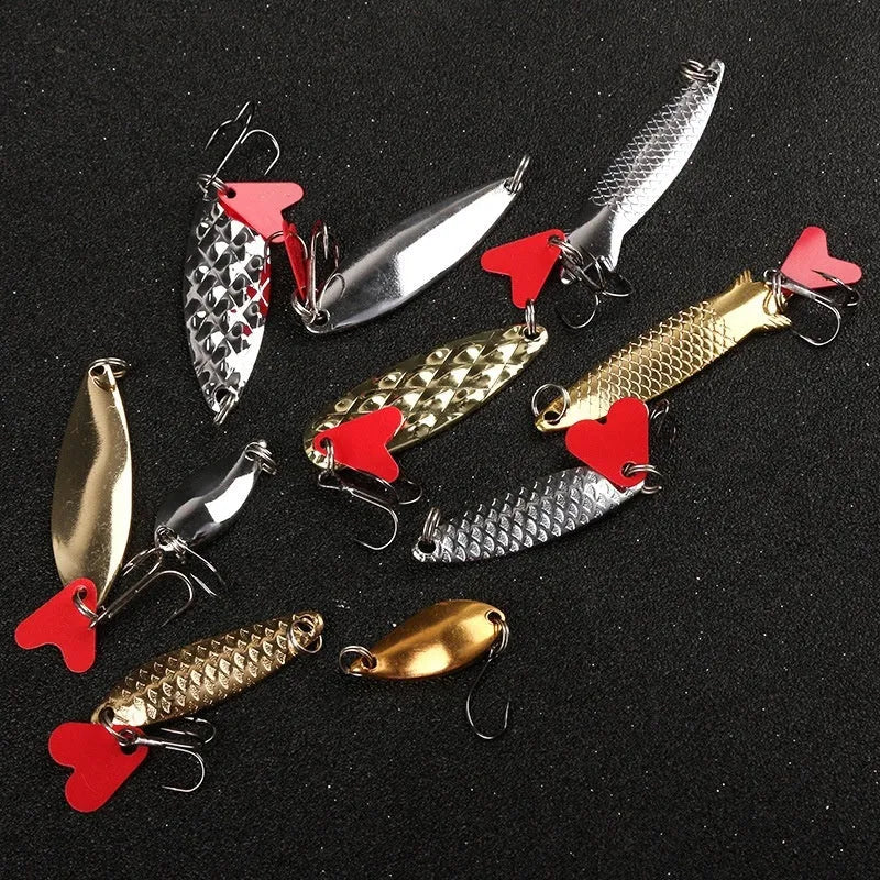 Box of gold and silver metal sequins for fishing lure repair and customisation.