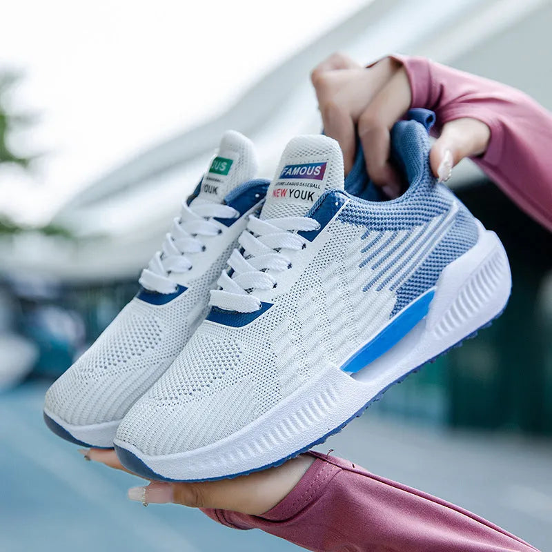 Men's blue casual mesh sports shoes with cloth upper and round toe on a plain background