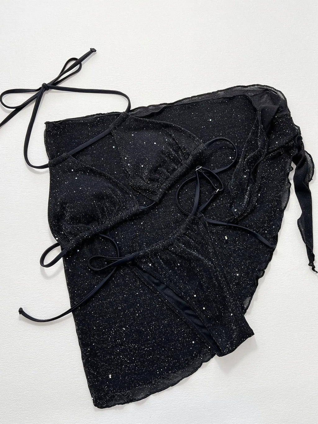 Black women's three-piece bikini swimsuit set with shorts on a mannequin