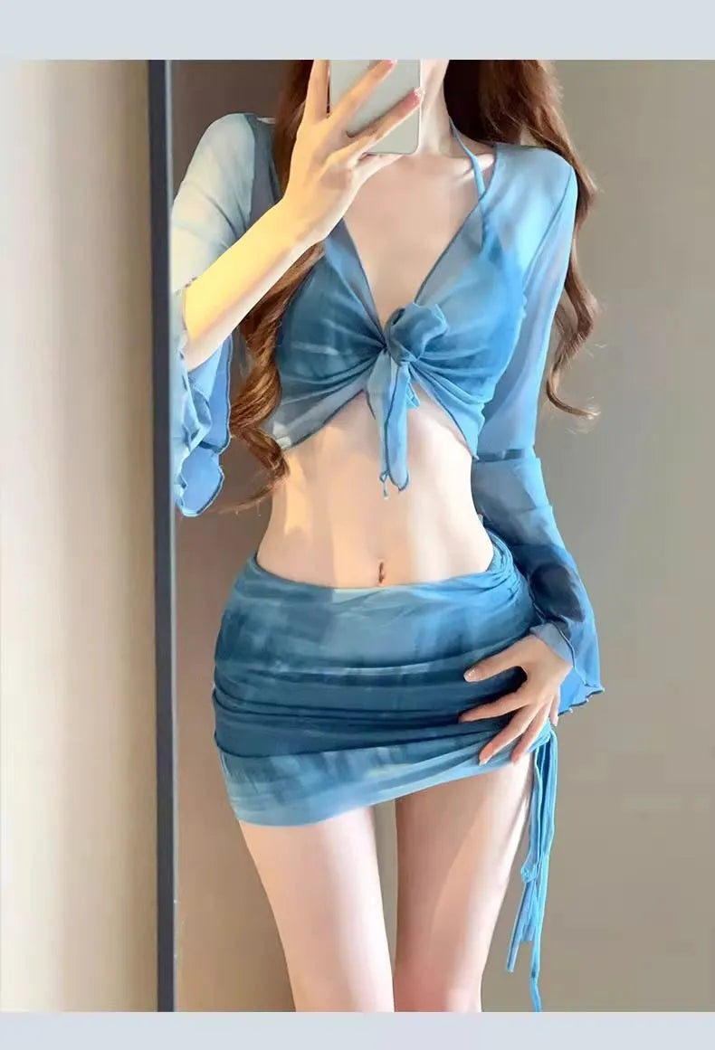 Women's blue high-waist four-piece bikini set with shirt, bra, underwear, and skirt on a mannequin