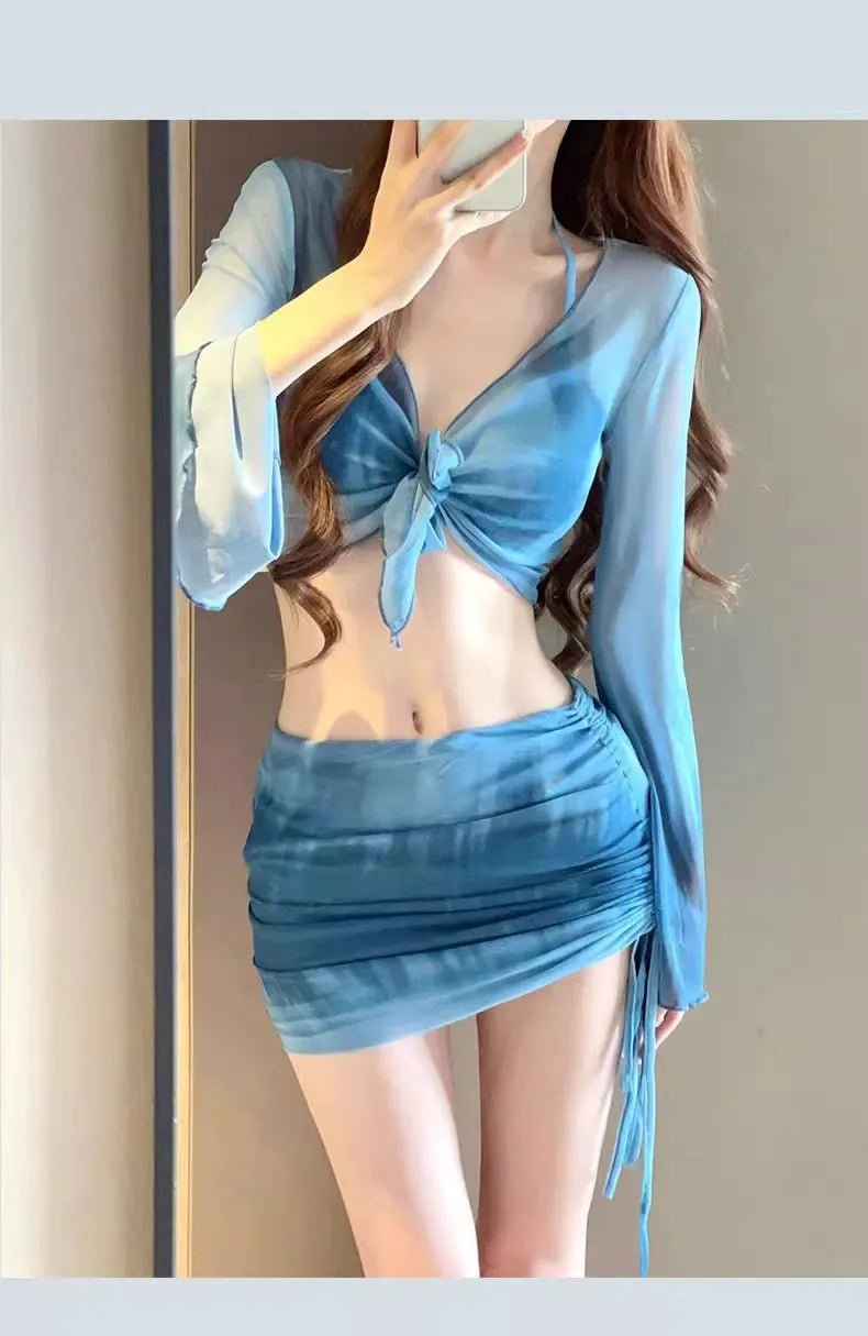 Women's blue high-waist four-piece bikini set with shirt, bra, underwear, and skirt on a mannequin