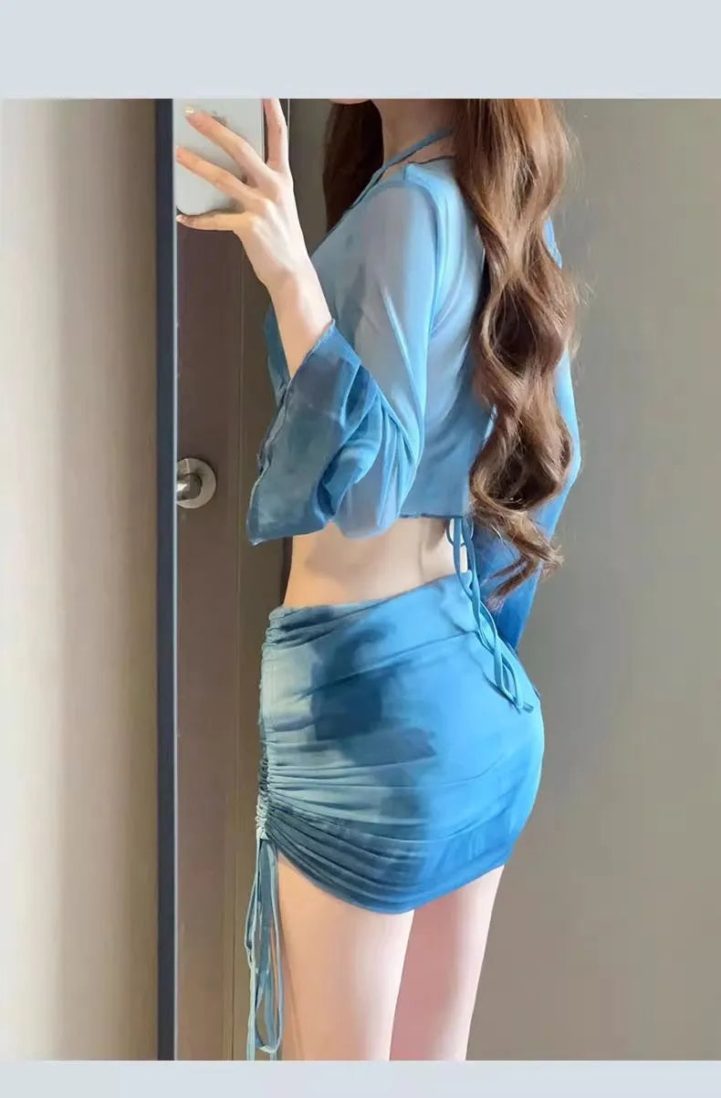 Women's blue high-waist four-piece bikini set with shirt, bra, underwear, and skirt on a mannequin
