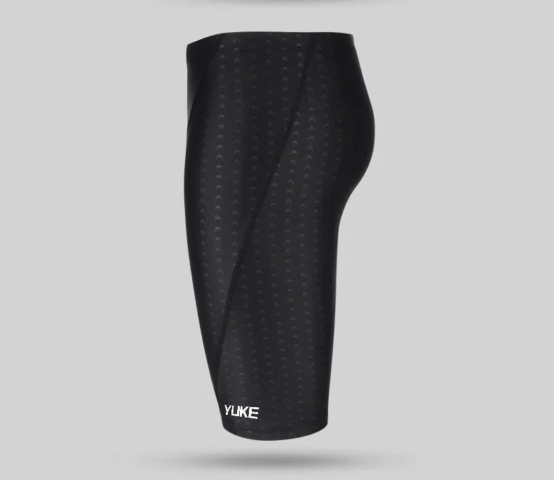 Men's black five-piece swimming set showing trunks, goggles, cap, ear plug nose clip and swimming bag