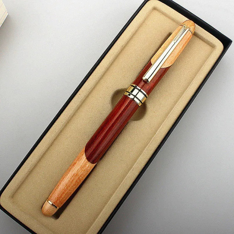 Metal ballpoint pen with wooden colour finish and black bag on white background