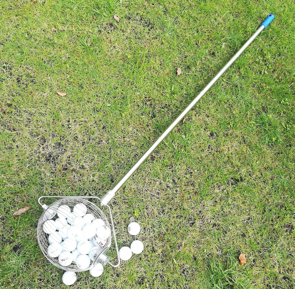 Metallic stainless steel golf ball picker tool on putting green