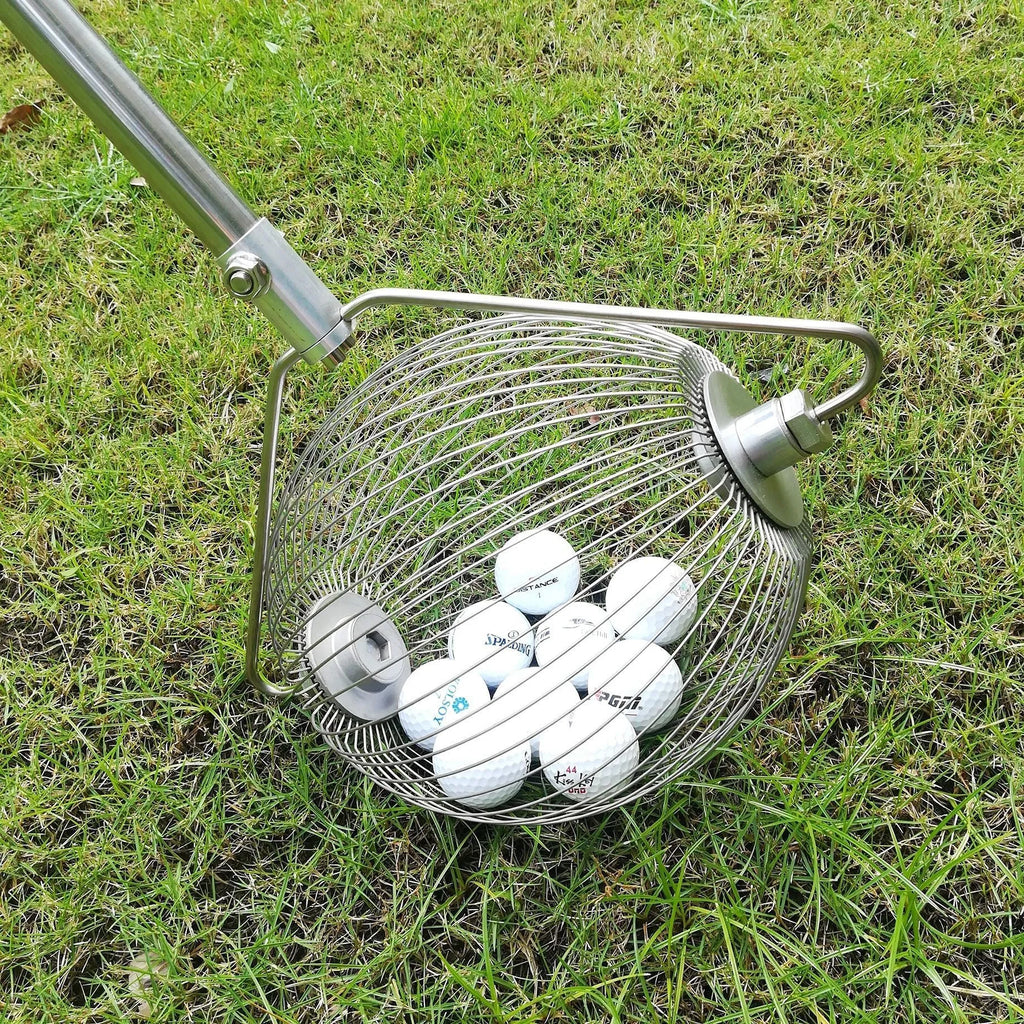 Metallic stainless steel golf ball picker tool on putting green