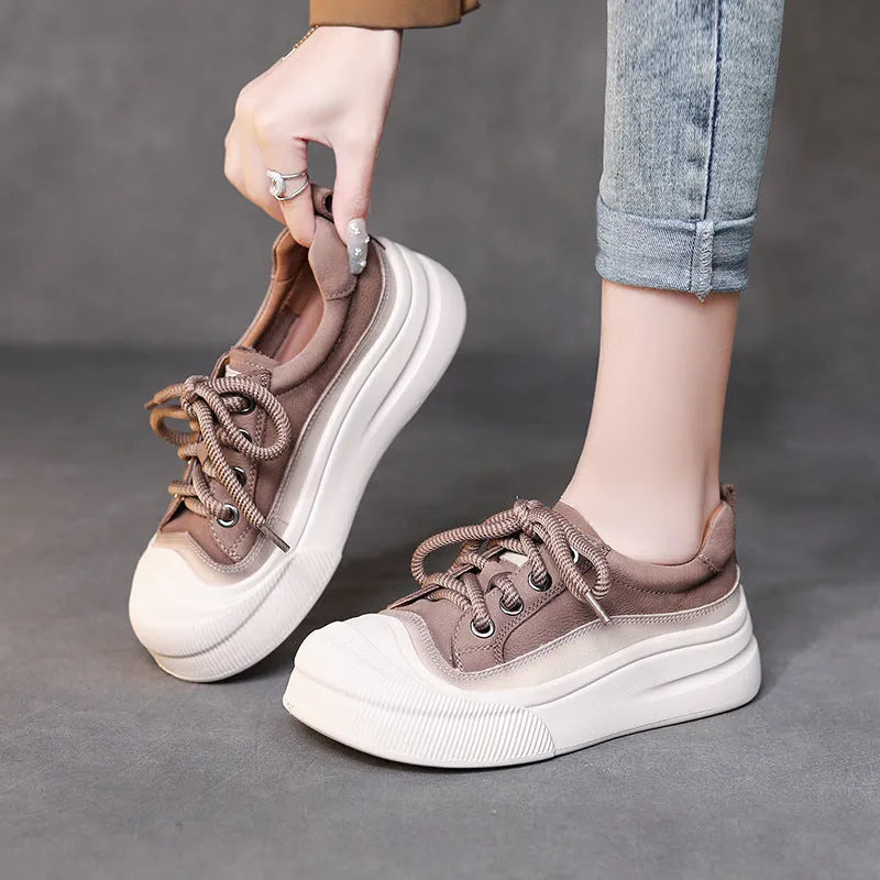 Women's brown leather lace-up casual shoes with round toe on white background