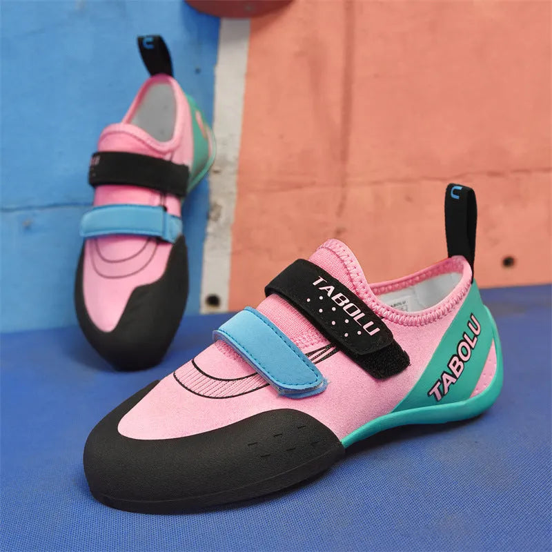 Men's and women's black beginner rock climbing shoes with coloured accents and Velcro strap
