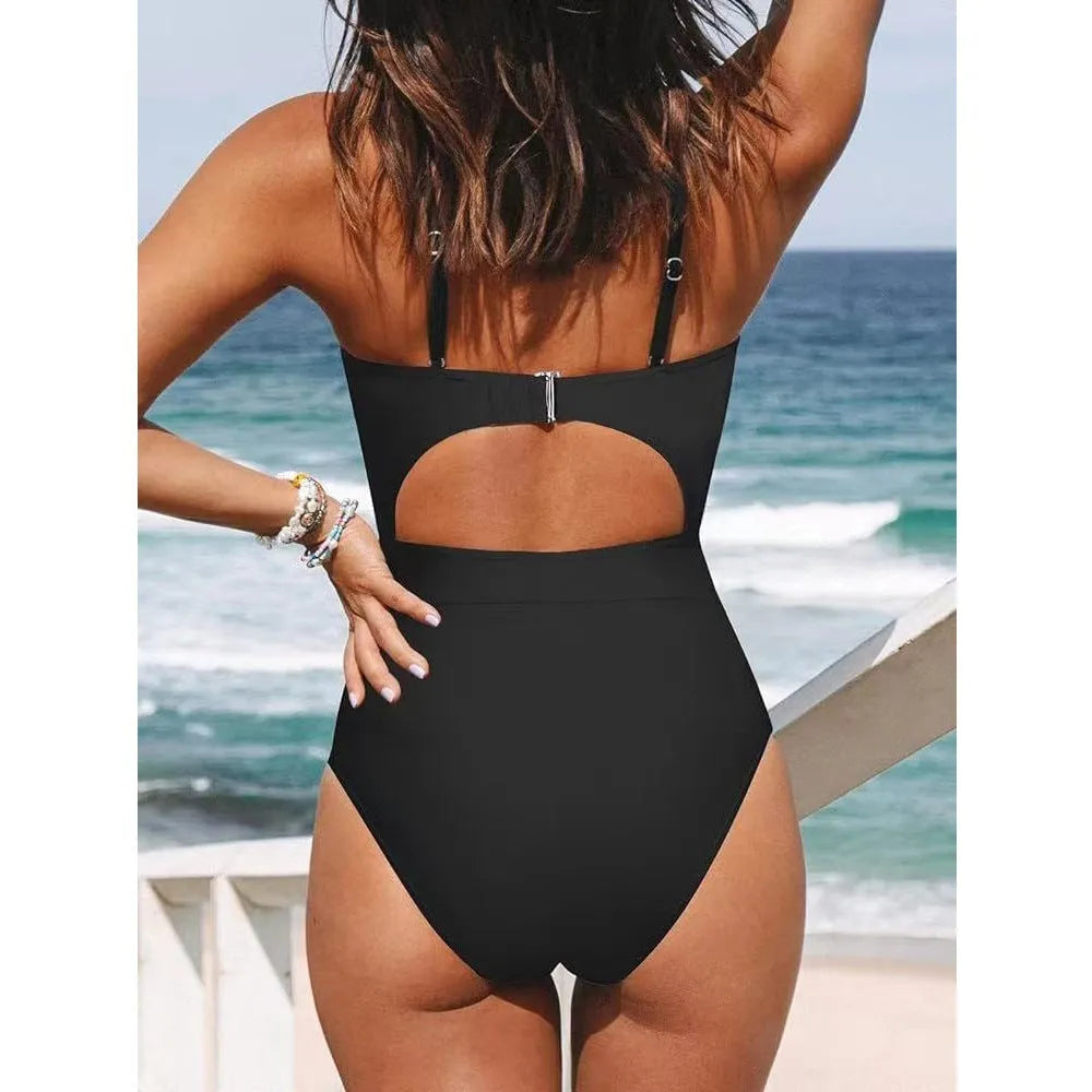 Women's solid colour backless one-piece swimsuit in polyester spandex blend on a mannequin.