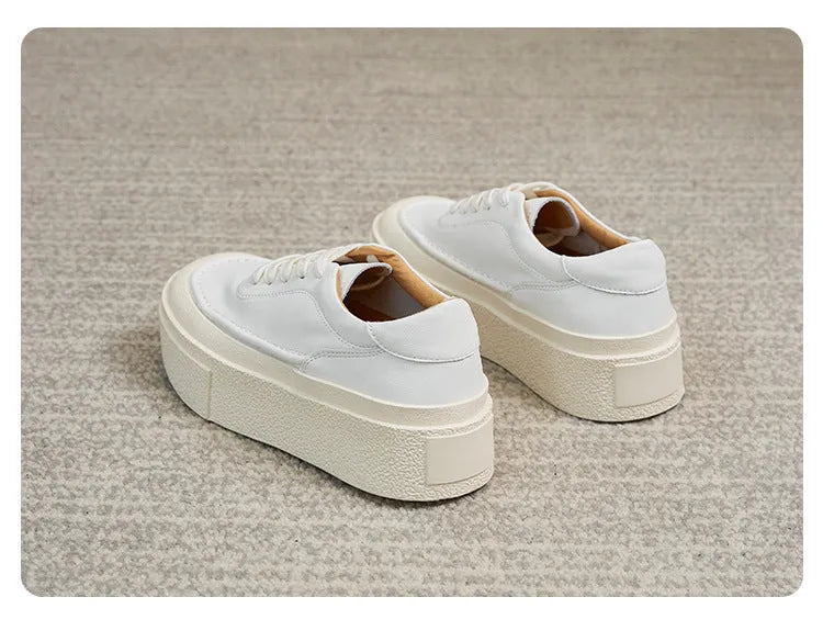 Women's black platform casual shoes with embossed cowhide texture and rubber sole