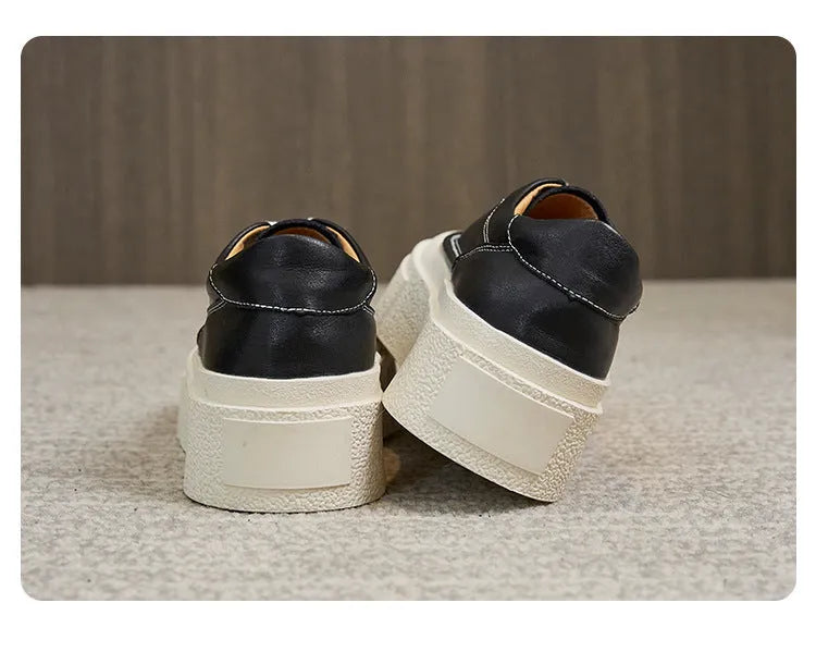Women's black platform casual shoes with embossed cowhide texture and rubber sole