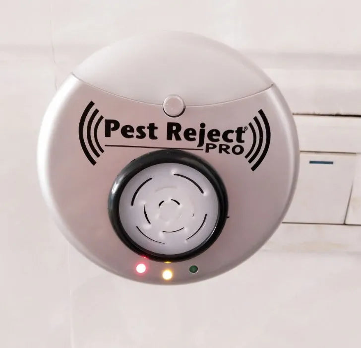 Silver grey intelligent ultrasonic mosquito repellent measuring 10cm, plugged into a white wall socket for indoor pest control