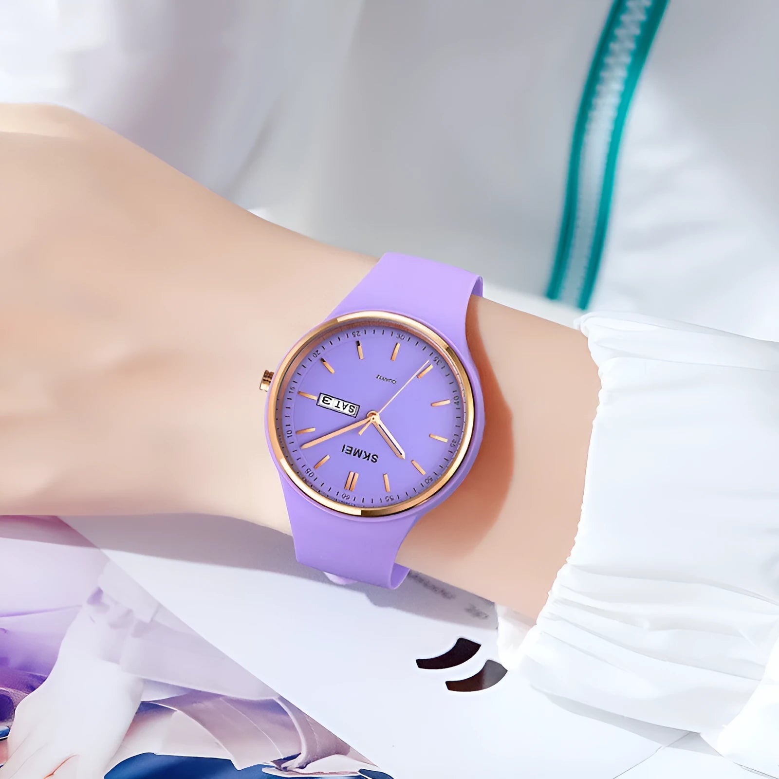Women's silicone strap quartz watch with calendar display on a white background, showing the stainless steel pin buckle.