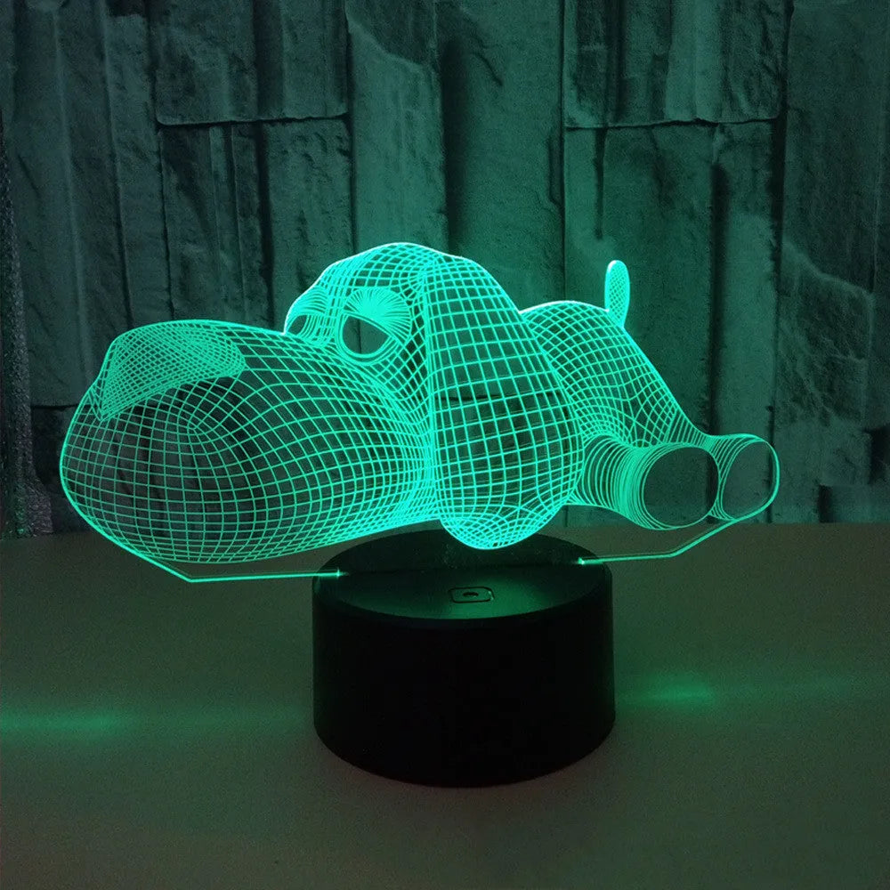 Doggo desktop lamp with 3D illusion design glowing in multiple colours on a desk.