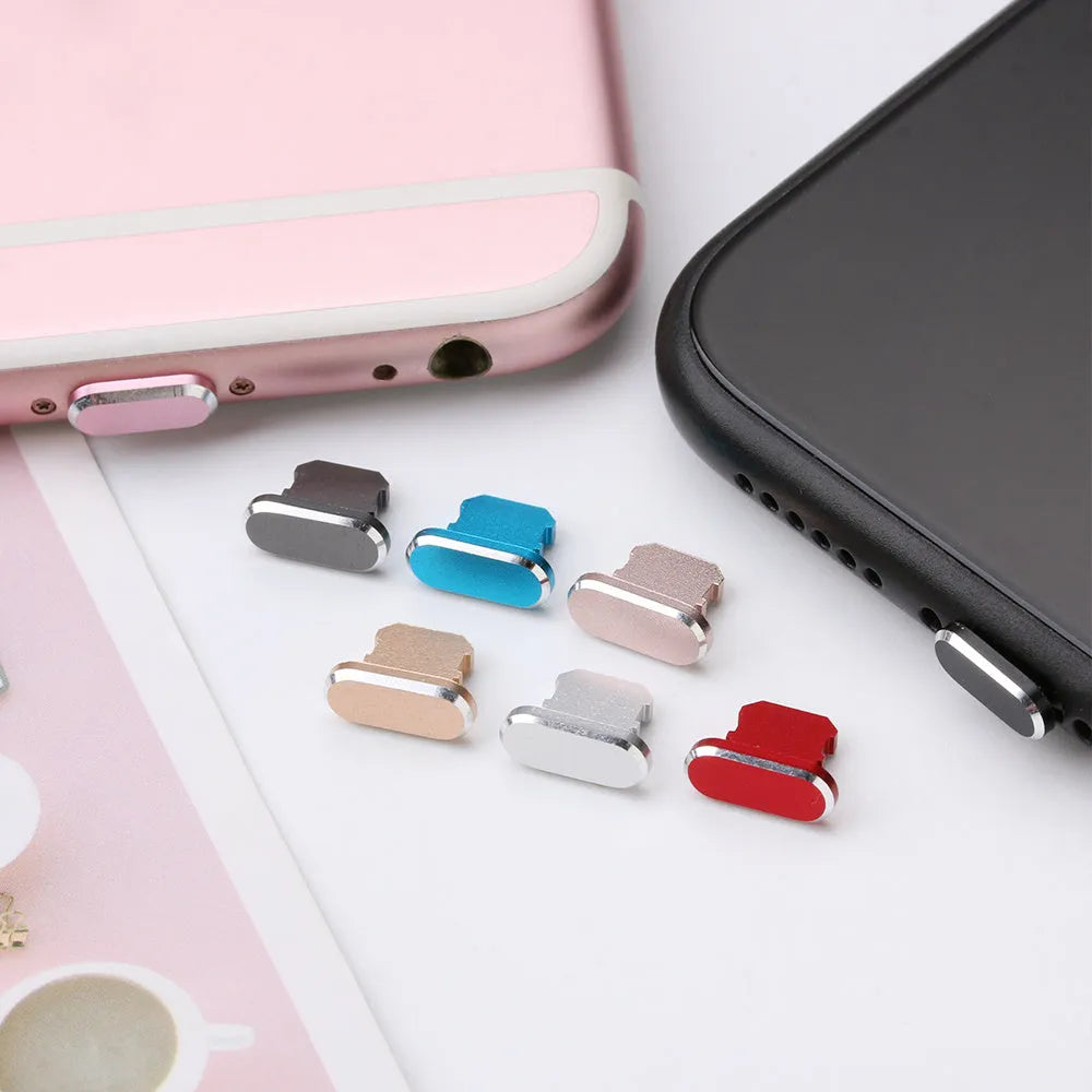 Aluminium alloy iPhone charging port dust plug shown in gold, silver, blue, red, grey, black, rose gold, and rose colours.