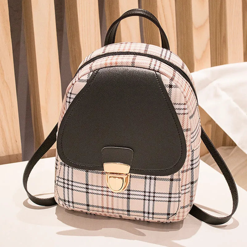A black PU one shoulder diagonal phone bag worn crossbody, also shown held in hand.