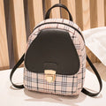 A black PU one shoulder diagonal phone bag worn crossbody, also shown held in hand.