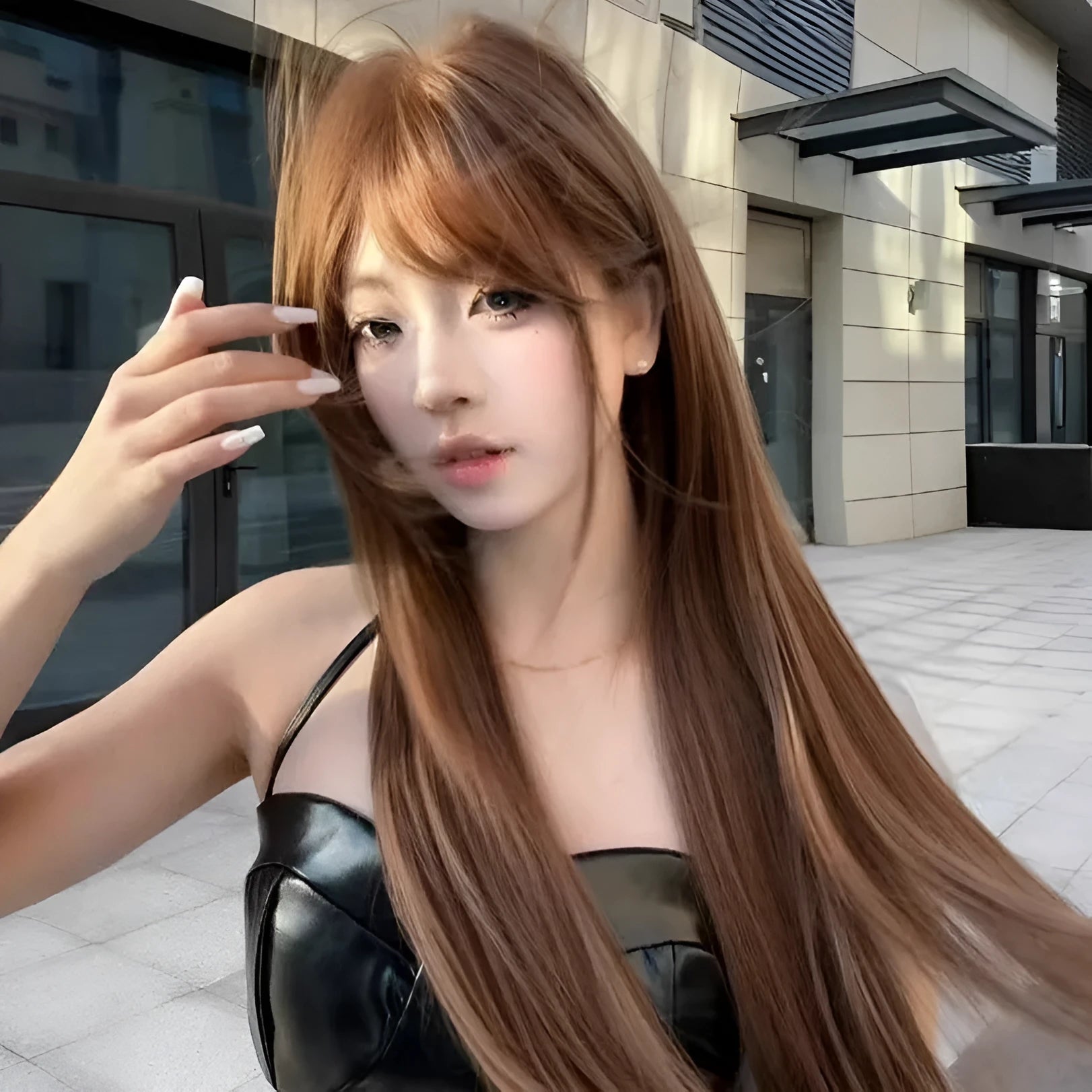 Warm brown long straight synthetic wig with full fringe bangs made from high temperature fibre.