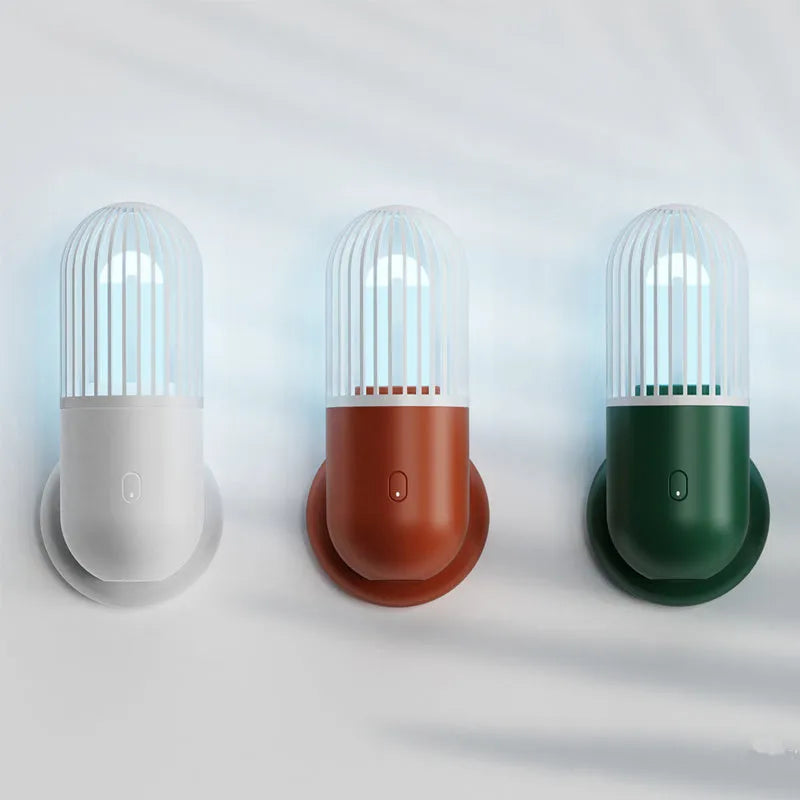 Portable capsule-shaped ultraviolet UVC disinfection lamp in black, showing compact size.