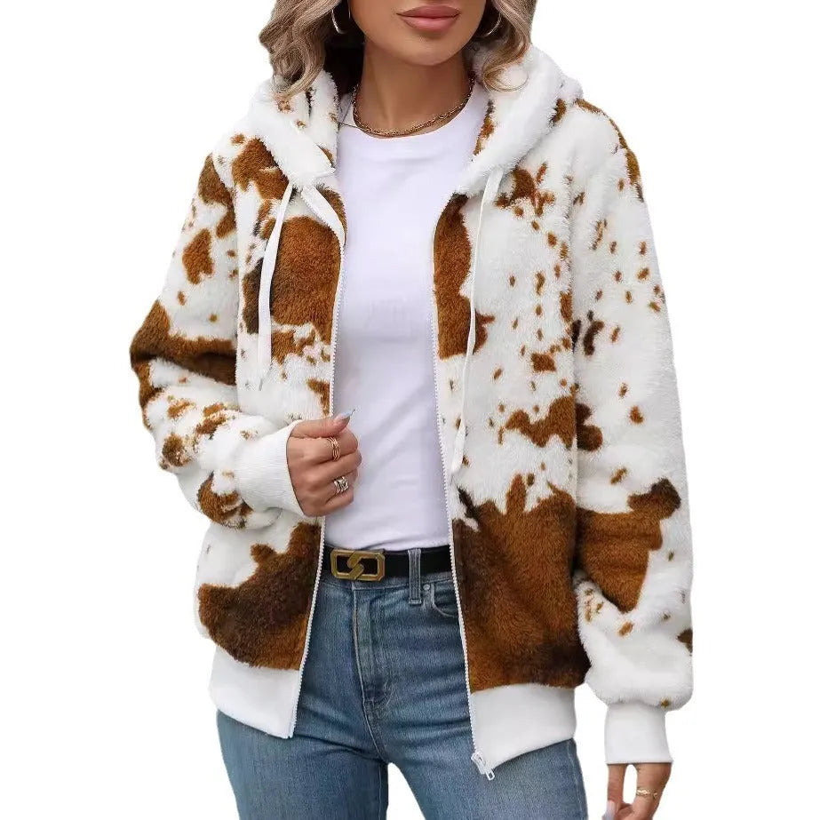 Yellow brown cow animal print hooded cardigan jacket with full zipper on a model.