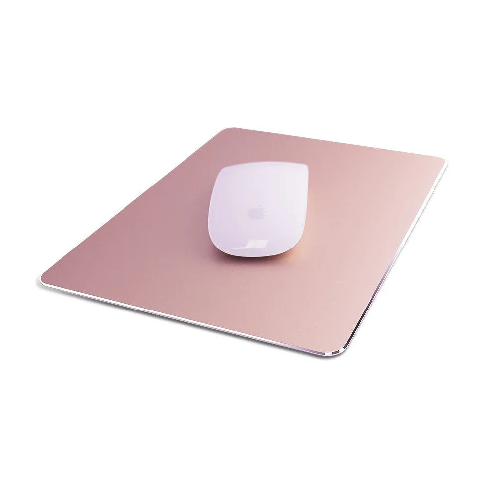 Double-sided aluminium non-slip mouse pad in black with smooth and textured surfaces on a desk