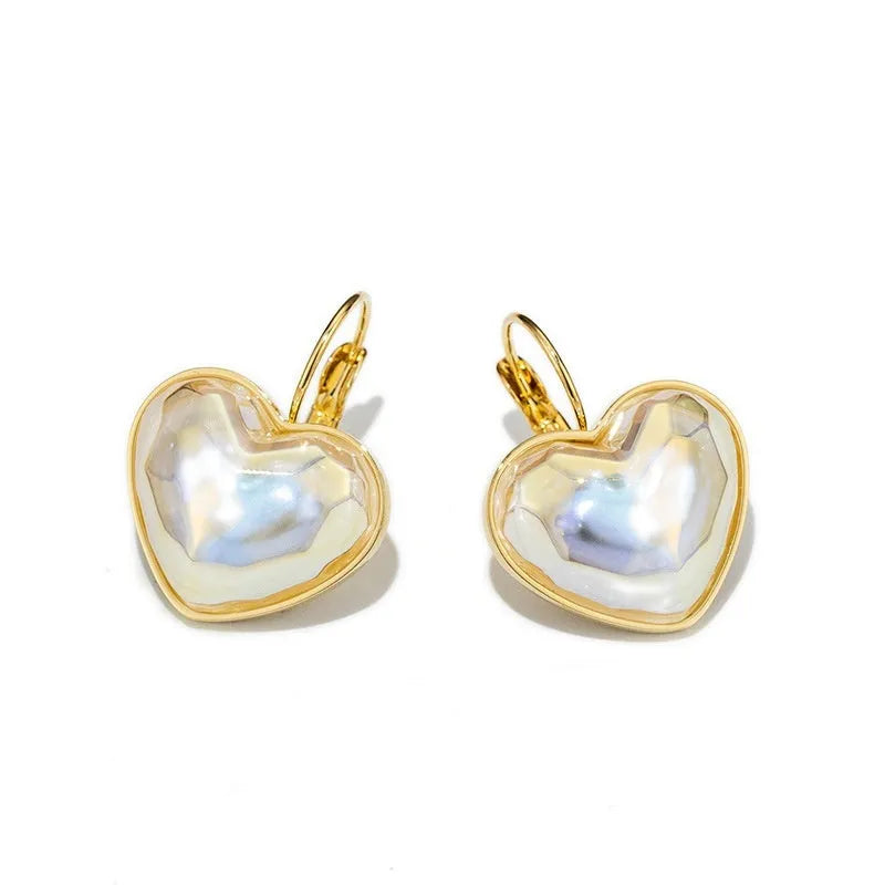A pair of gold-coloured alloy clip-on earrings for women in a natural style.