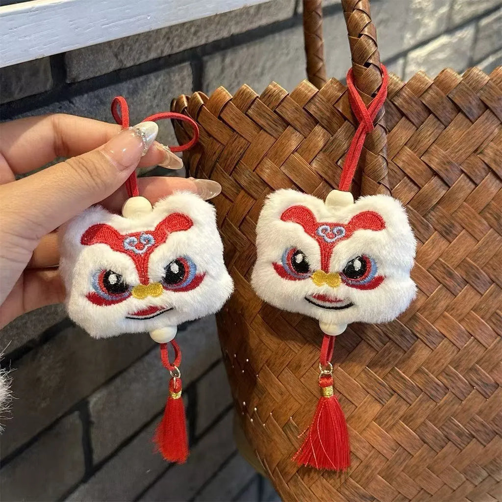 Chinese style blue and yellow plush lion keychain ornament with star stone decoration and cartoon styling