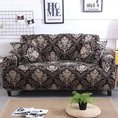 Stretchable geometric print sofa slipcover covering a three-seater sofa with matching pillow