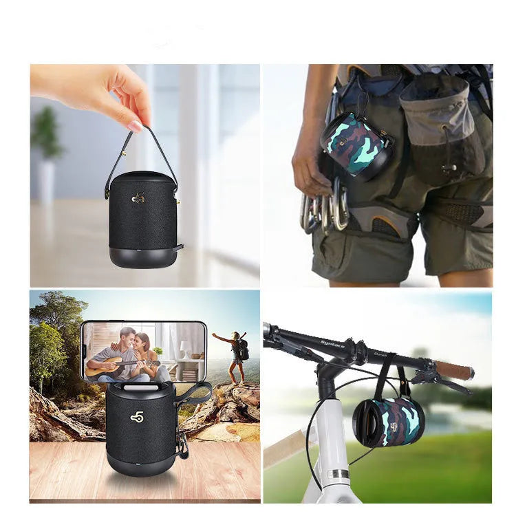 Waterproof portable bluetooth speaker in black with carry strap showing control buttons