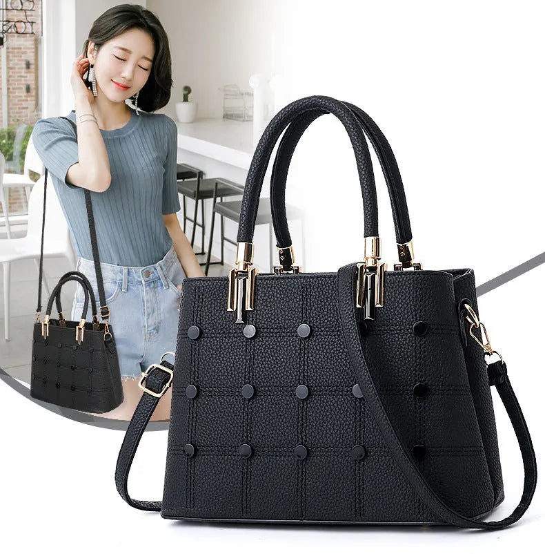 Women's handbag with rivet detailing in dark green, internal multi-pocket storage, PU outer and polyester lining