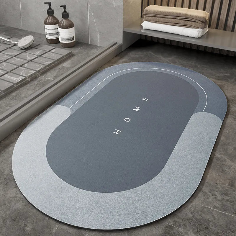Blue oval blended bathroom floor mat on tiled floor next to a bath.