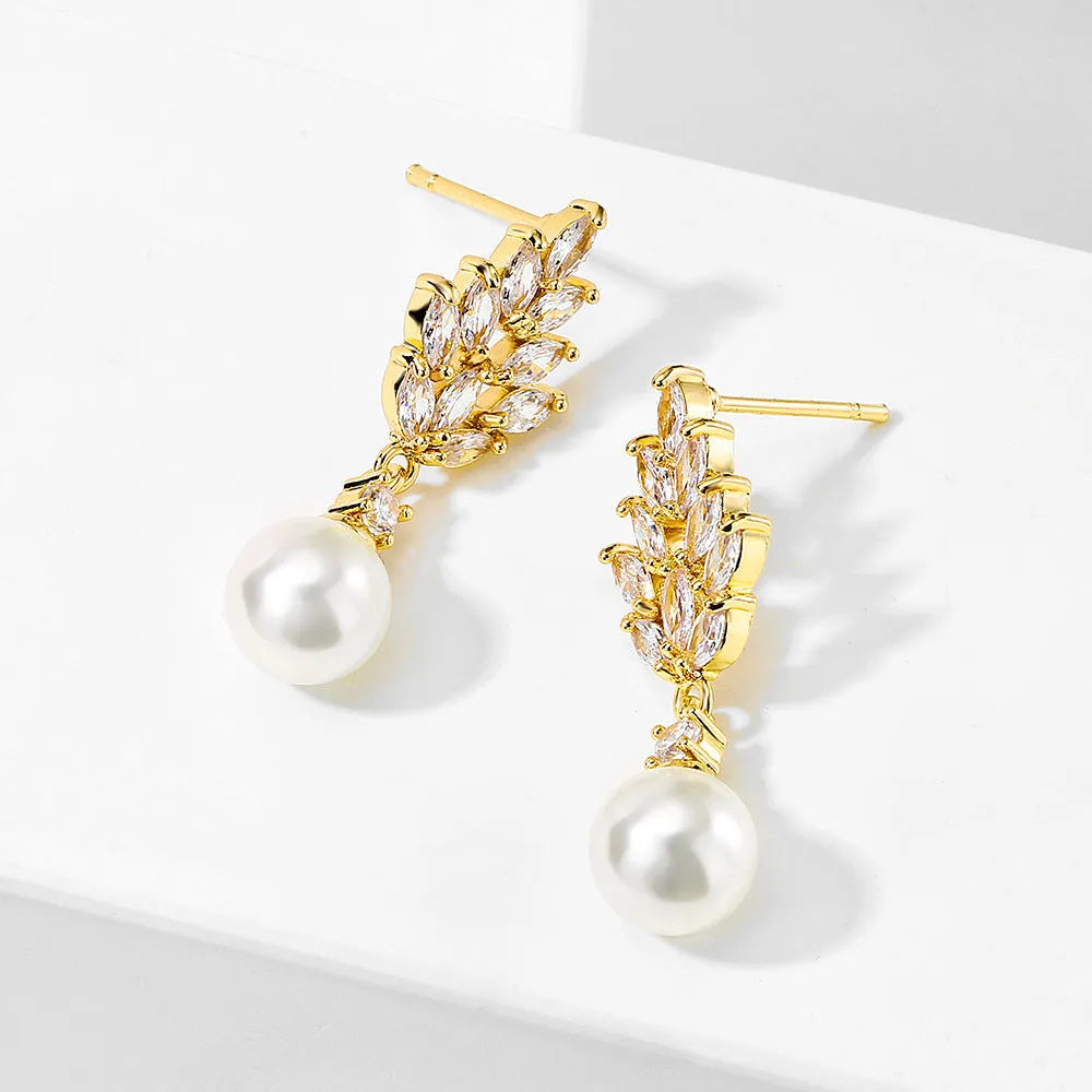 Geometric floral earrings with micro inlaid zircon and pearl details on copper with gold plating