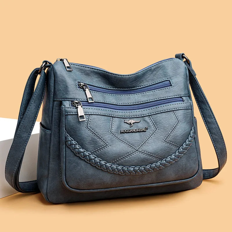 Soft PU leather shoulder bag with zippered compartments in horizontal square shape