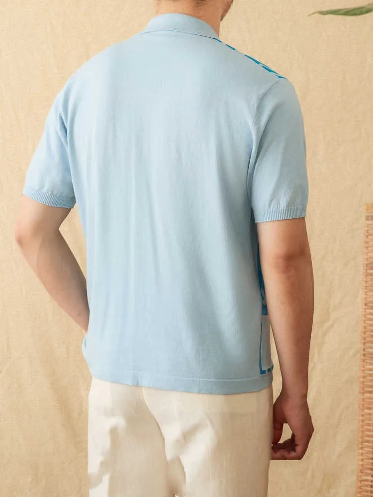 A man wearing a light blue striped short sleeve polo cardigan shirt with a lapel collar.