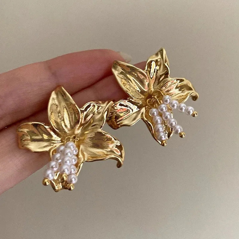 Gold floral pearl earrings with exaggerated design and Seiko-treated metal construction