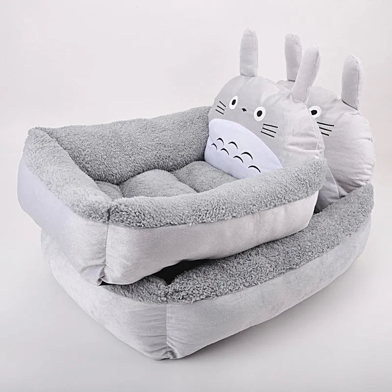 Cartoon-style plush pet sofa bed for small dogs and cats in blue colour, showcasing raised edges and non-slip bottom.